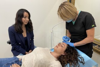 Journalist Antoinette Lattouf with a participant in the Botox experiment.
