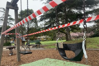 Tape blocks off access to swings at Basterfield Park in Hampton East on Tuesday, as stricter COVID-19 restrictions came into effect in Melbourne.