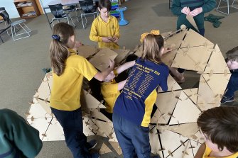 Students at Quarry Hill Primary School in Bendigo playing Unboxy, a building game schools are using to help kids settle back into school after lockdown.
