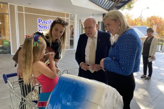 John Howard and Liberal candidate for Macquarie Sarah Richards meet Hannah Rosier, 31, and her children Ivy, 4, and Darcy, 2, in Richmond.