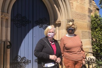 St Paul’s Anglican Church in Burwood welcomed back parishioners including Elizabeth Griffiths (left) and Margaret Whittaker (right) on Sunday after more than three months in lockdown.