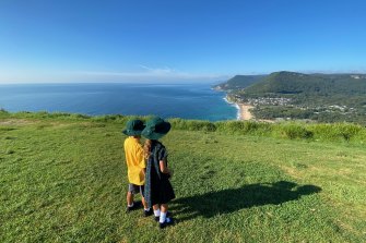 Matilda McCullough, with her brother, at Stanwell Park, her new home where she feels safe.  