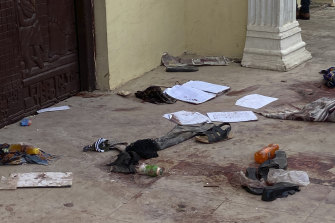 Personal belongings and shoes lie on the pavement of St Francis Catholic Church in Owo.