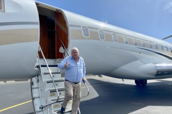 Clive Palmer disembarks from his private jet to campaign for the United Australia Party in Gladstone.