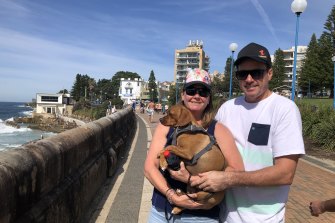 John and Stacey Wilson, of Hillsdale, with dog Cooper at Coogee Beach on Easter Monday.