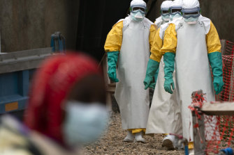 Health workers dressed in protective gear begin their shift at an Ebola treatment centre in Beni in the Democratic Republic of Congo.