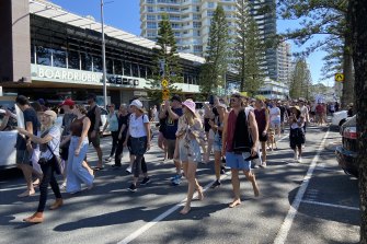 People gathered on Coolangatta Esplanade protesting an end to vaccinations and lockdown. 