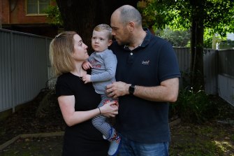 Alicia and Andy Jones, with their son Miles. Ms Jones caught COVID-19 twice, once as the Delta wave peaked and in March as Omicron swept through NSW.