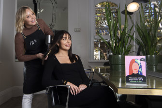 Penny Jennifer Garry (standing) with Barney Martin manager Wednesday Hulme. Both women participated in training for hairdressers in how to talk about climate action with their clients.