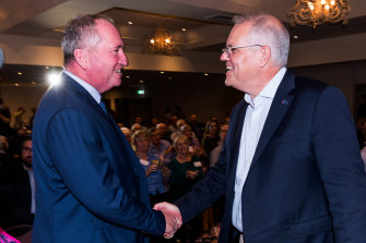 Scott Morrison greets Barnaby Joyce at the event.