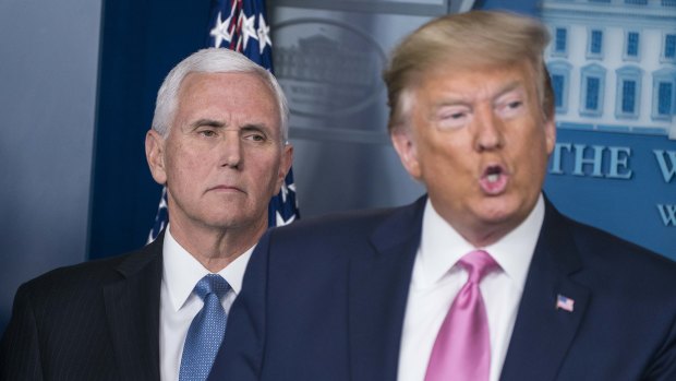 Donald Trump with Vice-President Mike Pence whom he appointed to lead the US government's coronavirus response. "You don't want to see panic because there's no reason to be panicked."