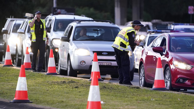 Motorists are stopped at a checkpoint at Coolangatta on the Queensland/NSW border.