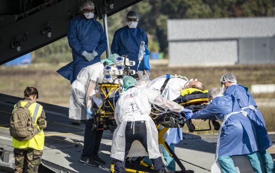 A COVID-19 patient at Avignon  is evacuated on a French Air Force plane to Brest. As hospitals near capacity in France, patients requiring urgent treatment are being transferred across the country.