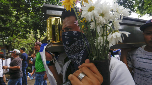 Friends and family carry the coffin with the body of Gerald Vasquez at his funeral on Monday.