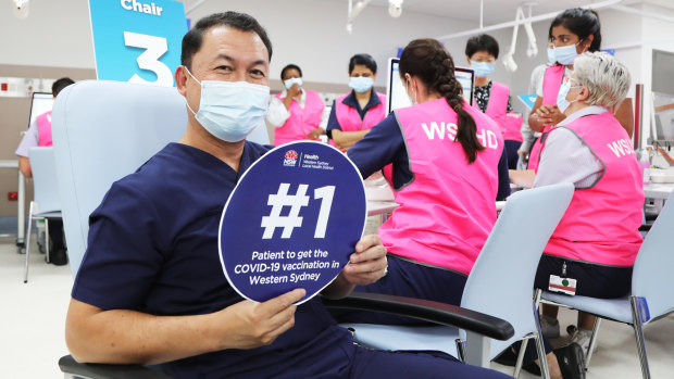 Emergency department nurse Dante Canete was the first to get the COVID-19 vaccination at the vaccination hub at Westmead Hospital.