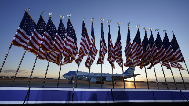 Air Force One is prepared for outgoing US president Donald Trump as flags fly on a stage at Andrews Air Force Base.