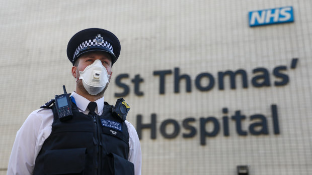 A police officer outside St Thomas' Hospital, where Boris Johnson was being treated.