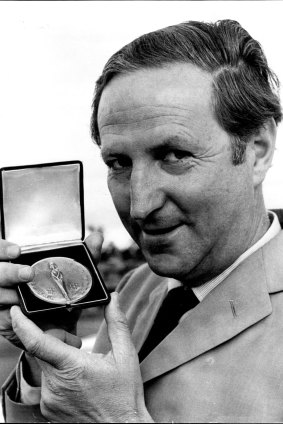 William McBride pictured at Sydney Airport holding the medal presented by the Institute De La Vie in Paris. 