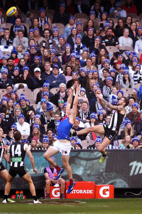 Jeremy Howe with the mark (that wasn't) over Tom McDonald during the Queen's Birthday clash at the MCG.