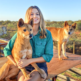 Zali Jestrimski at Wooleen Station with dingoes Eulalia and Steven.
