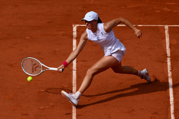 Iga Swiatek of Poland plays a forehand against Karolina Muchova during the women’s final of the French Open. 