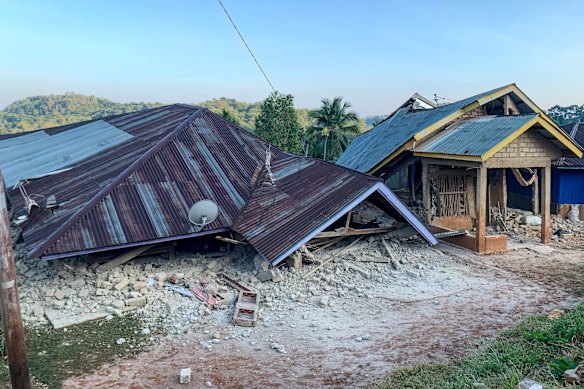 Damaged houses following a 7.7-magnitude earthquake in Ruteng, Indonesia.