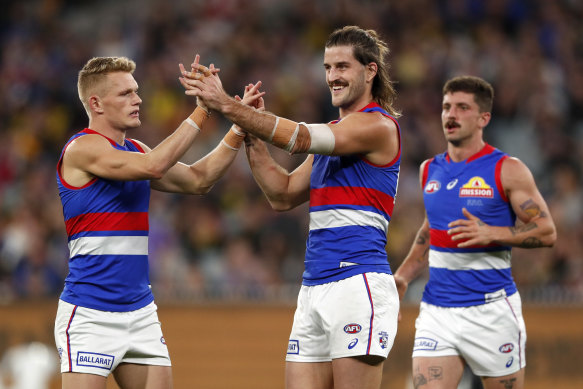 Josh Bruce celebrates with his teammates.