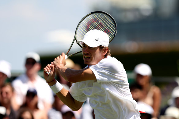 De Minaur plays a backhand against Berrettini.