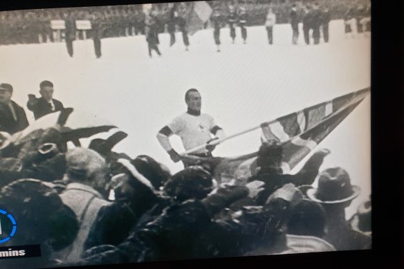 Australian Freddie McEvoy carries Britain’s  Union Jack flag at the 1936 Winter Olympics.  