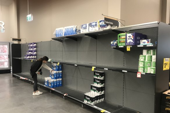 Almost empty shelves in a supermarket in Sydney.