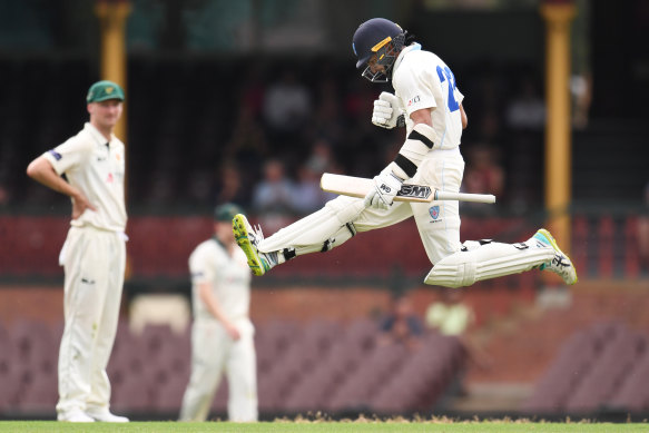 Jason Sangha celebrates his maiden Shield century for NSW in 2018.