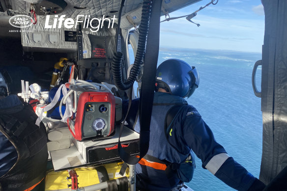 Rescue workers search for Jordan Kelly from one of eight aircraft that scoured the area off North Stradbroke Island on Sunday.