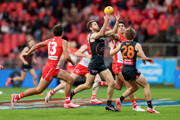 Callan Ward of the Giants controls the ball.