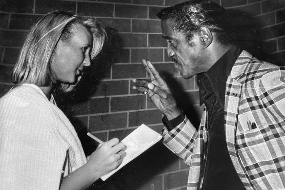 Sammy Davis Jr delivering some sage advice to a 19-year-old Kate Halfpenny.