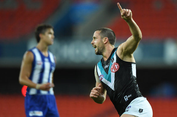 Travis Boak celebrates after booting a goal for Port Adelaide in their win over the Kangaroos.