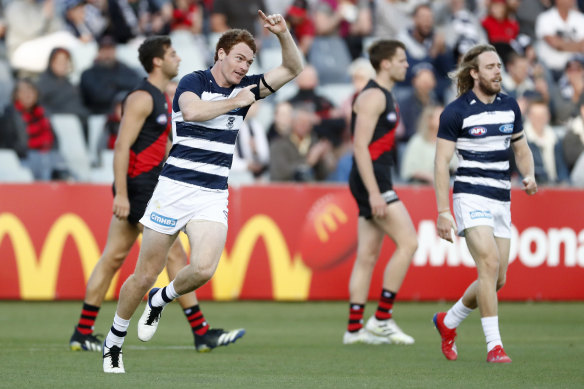 Gary Rohan celebrates after scoring for the Cats in their win over the Bombers.