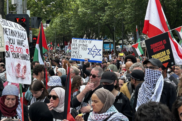 A protester holds up a swastika, a symbol banned in Victoria, at a pro-Palestinian rally in Melbourne on October 6.