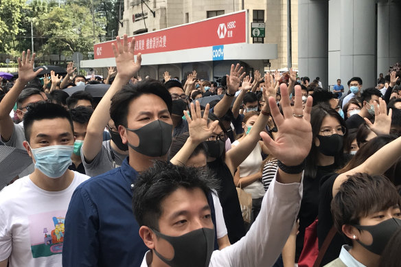 Protesters march outside the HSBC building in Hong Kong on Friday.