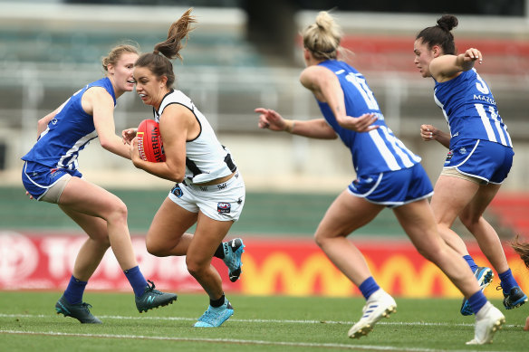 Magpie Chloe Molloy makes a run for it at Ikon Park. 