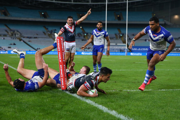 Matt Burton takes Joseph Suaalii into touch late in the game to save a try.