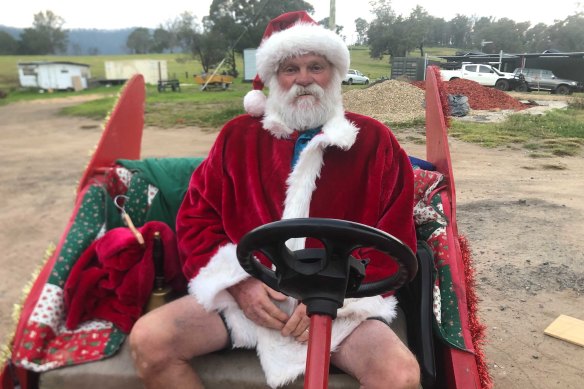Cobargo’s Santa and retired volunteer firefighter Dave Rugendyke on his new sleigh.