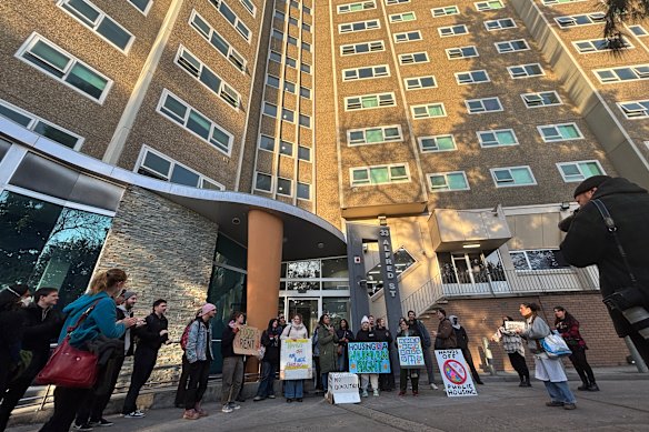 Protesters outside the housing tower at 33 Alfred Street, North Melbourne on Monday.
