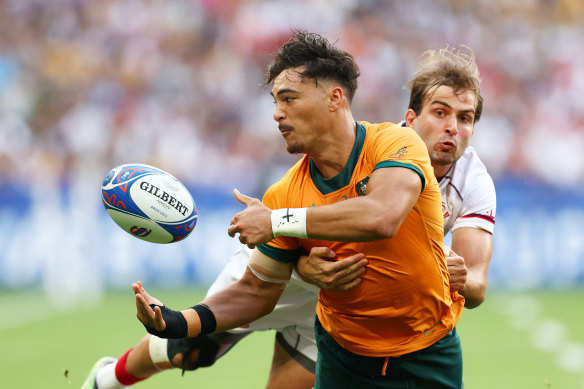 Jordan Petaia passes the ball under pressure