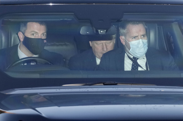 British Prime Minister Boris Johnson, centre, leaves Parliament after attending the weekly Prime Minister’s Questions session in London.