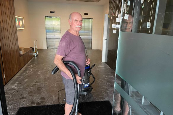 Vicinity Apartments building manager John Cronin has been helping clean up since 2.30am Saturday morning following the water damage at the Woolloongabba building.