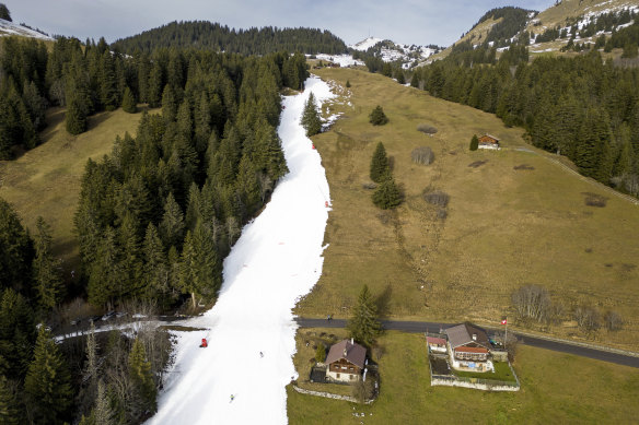 Skiers coast down artificial snow at 1600 metres above sea level in Villars-sur-Ollon, Switzerland, on New Year’s Eve.