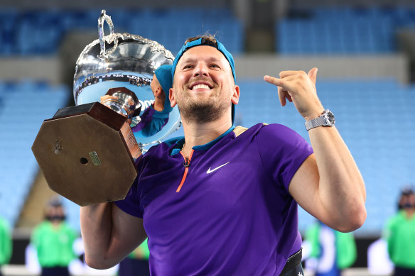 Dylan Alcott celebrates after winning his seventh consecutive Australian Open title early on Thursday morning.