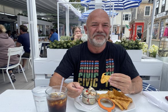 Journalist Andrew Sullivan eats ceviche for appetiser at Patio Bar & Grill in Provincetown, Massachusetts.  
