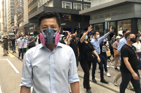 Richard, 29, an engineer, was among the thousands of ordinary office workers to march through central Hong Kong on Friday to protest against a government move to invoke emergency powers banning face masks.