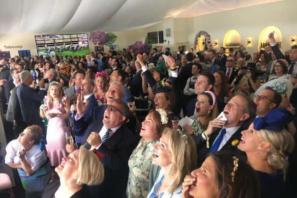 Bill and Chloe Shorten among the crowd watching The Cup from the Tabcorp marquee in The Birdcage.